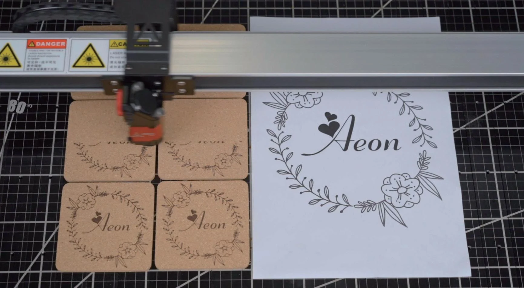 NOVA overhead camera positioning artwork over material on the work table