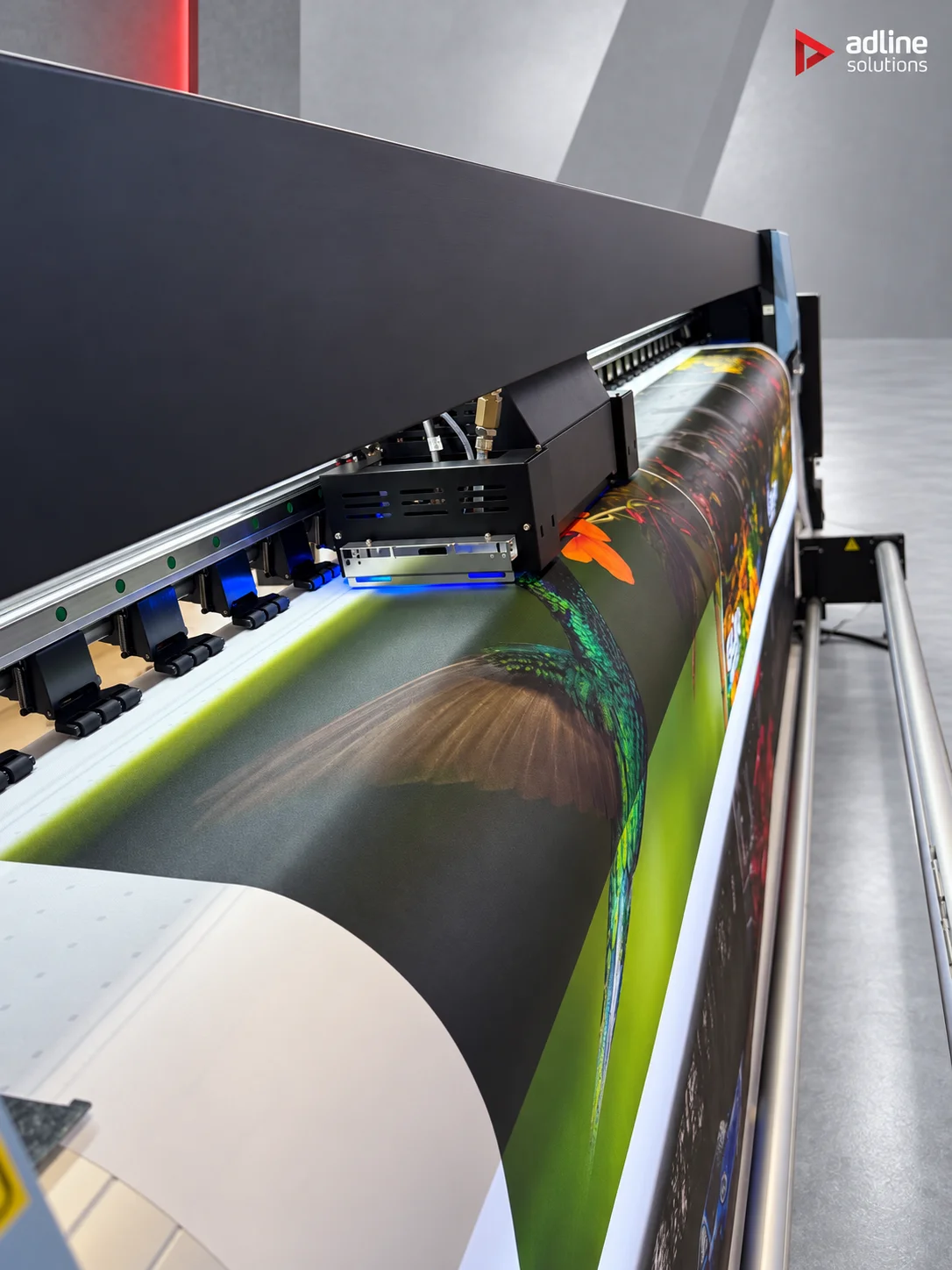Galaxy UD-32R8BE eco-solvent roll printer, print head carriage close-up over printed media