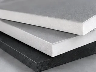 Stacked white and black foam boards showing the foam core edge