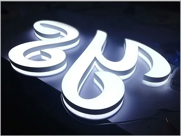 Illuminated white script lettering